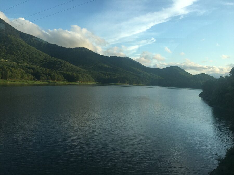Lake Kanayama in summer with surrounding hills