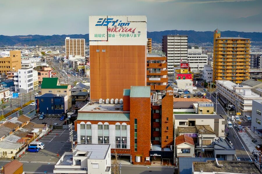 Aerial view of Wakayama city centre with mountains in the distance