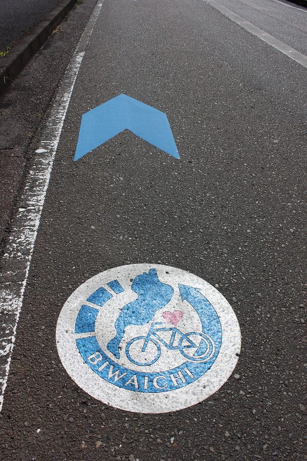 Blue Biwaichi route sign on Lake Biwa shoreline path