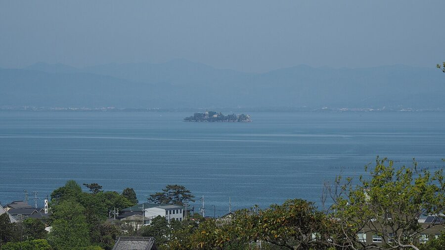Lake Biwa lakeshore cycling path with Hira Mountains in distance