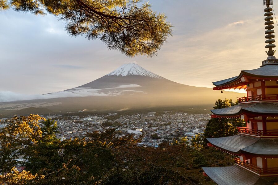 Mount Fuji rising behind a red pagoda in Yamanashi