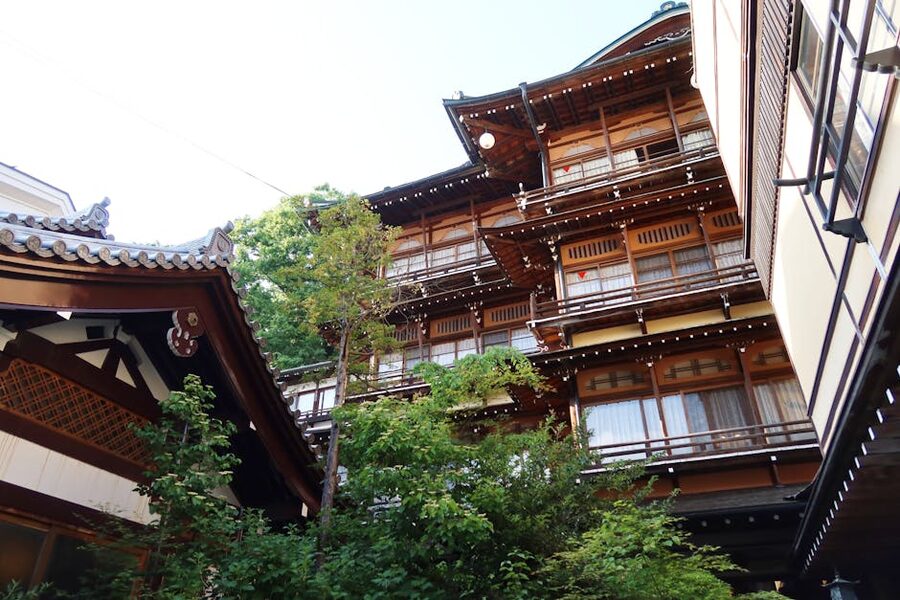 A traditional Japanese ryokan exterior with wooden architecture