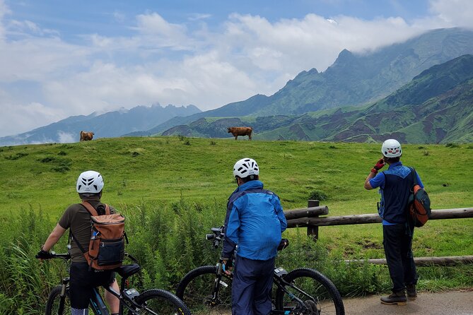 Private E-MTB guided cycling around Mt. Aso volcano & grasslands - Riding from Aso Station into the caldera