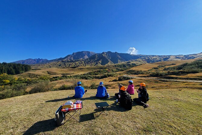Private E-MTB guided cycling around Mt. Aso volcano & grasslands - The downhill return and wide caldera views