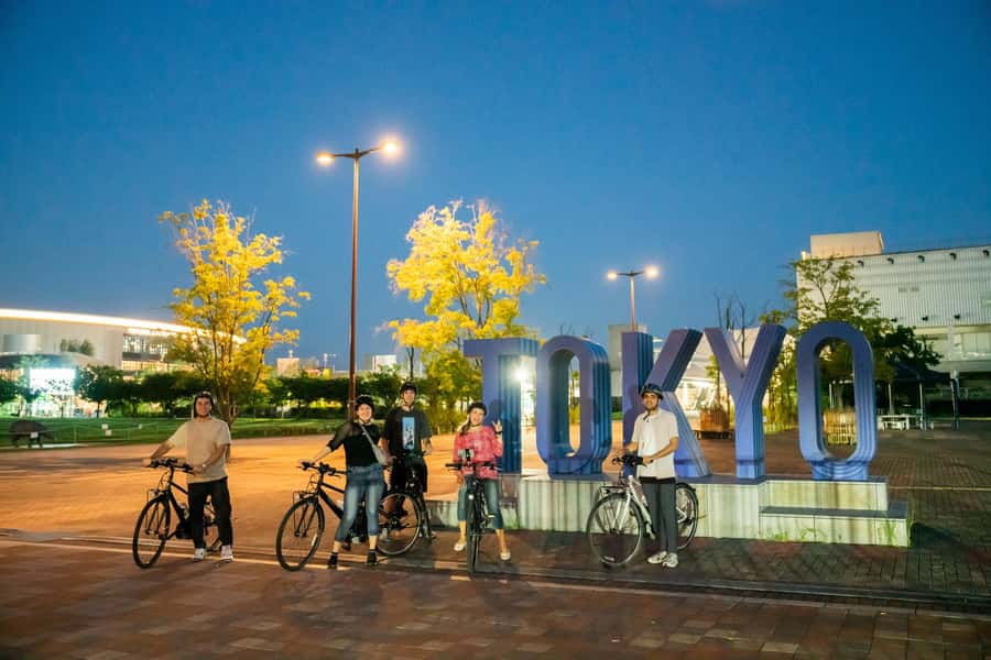 Tokyo Bay Area: Sunset Night View 3h E-bike Guided Bike Tour - From fish market streets to the edge of Tokyo Bay